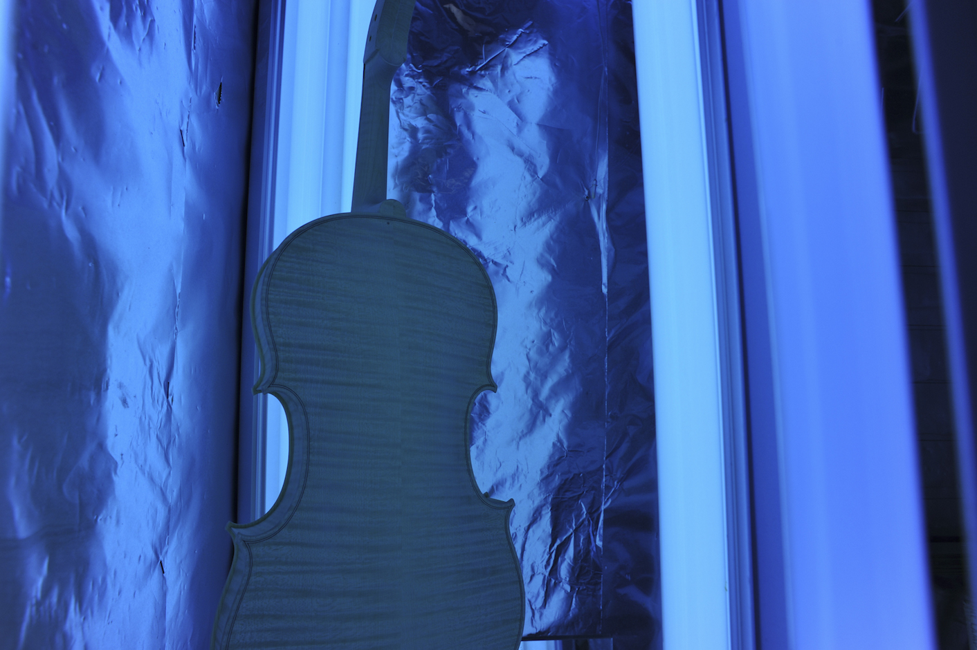 Each instrument will spend some time in the ultraviolet light box before and during varnishing to develop a natural golden color on the wood and to cure the varnish