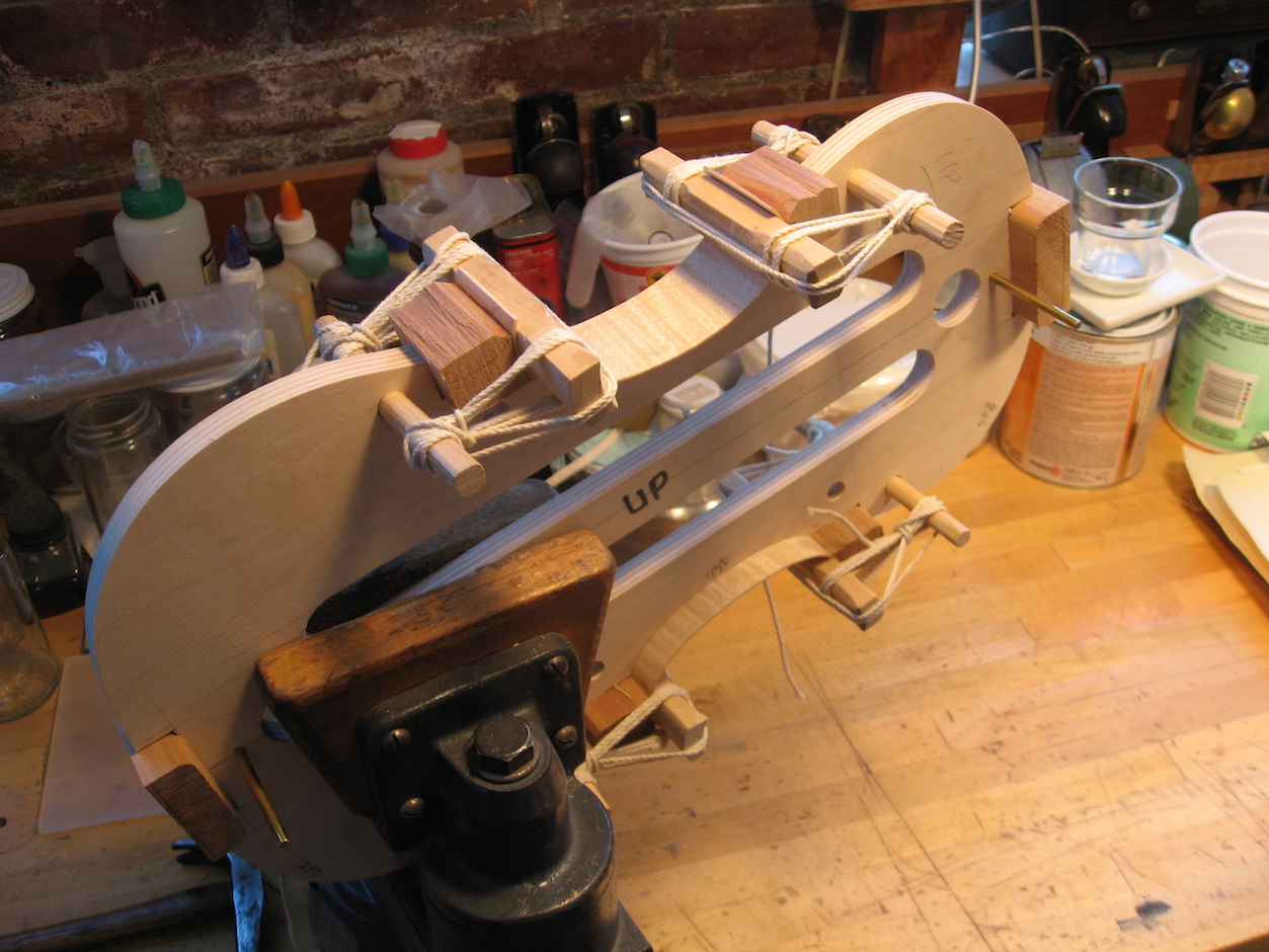 Gluing the ribs to the corner block with dowels and string in the old Cremonese tradition